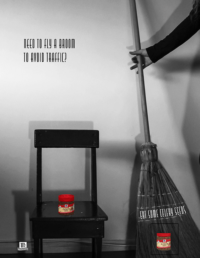 person taking broom off wall to fly over traffic with celery seed container on chair