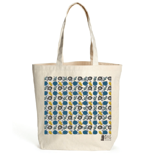 canvas tote bag of design 2, infinity pattern with circle cartoon skulls in the background of horses, wooden wheel, automobile wheel and coffins.